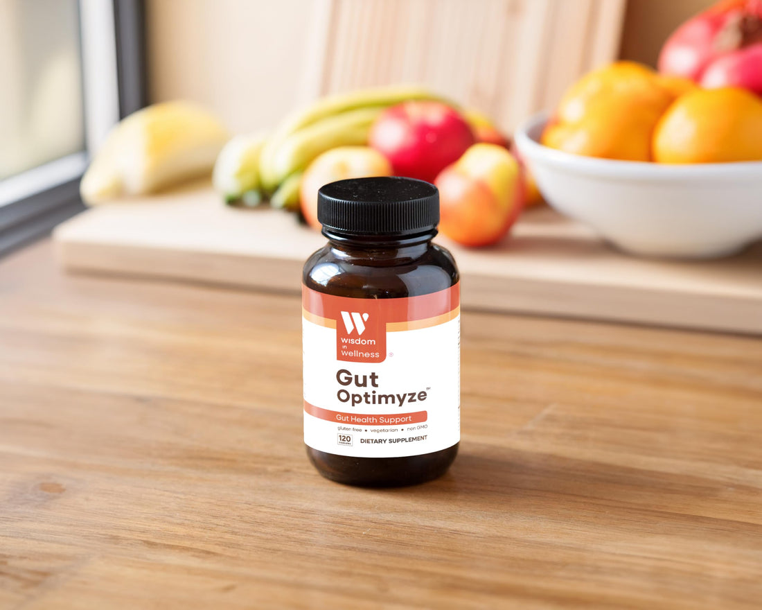 Supplement bottle labeled 'Gut Optimize' by Wisdom Wellness on a white background