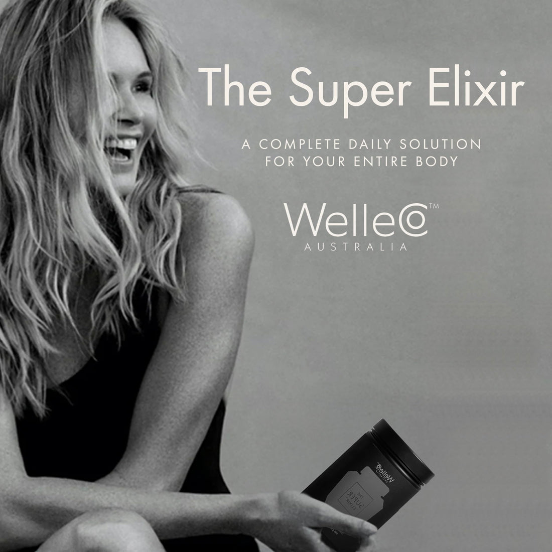 WelleCo The Super Elixir dietary supplement container with green powder on a white background