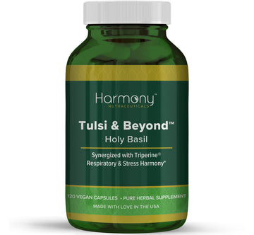 Green supplement bottle labeled 'Harmony Tulsi & Beyond' on a white background